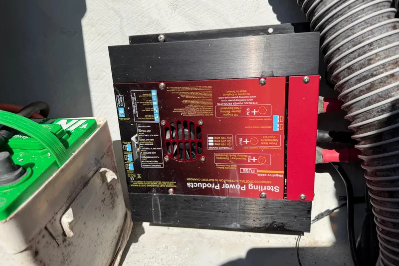 Slide: The Image of Cozy seating area on a 2014 Outremer 45 catamaran with wooden table and cushions. - 72