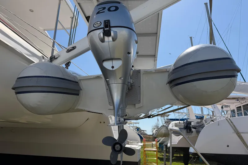 Slide: The Image of Engine compartment of a 2014 Outremer 45 catamaran, showcasing mechanical components and wiring. - 77