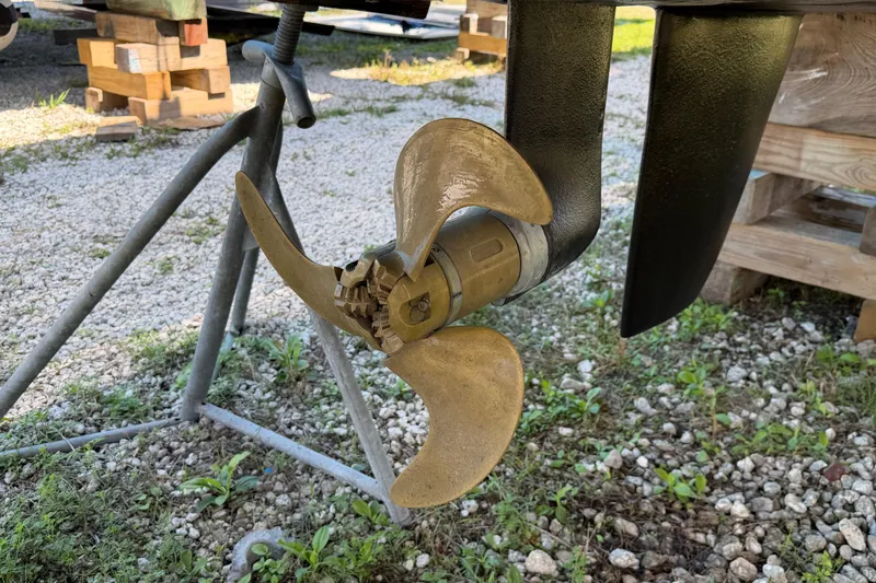 Slide: The Image of Outremer 45 catamaran with outboard motor, 2014 model, docked in a marina. - 82