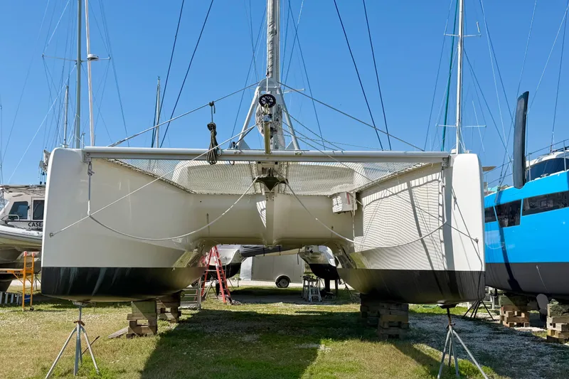 Slide: The Image of Propeller of a 2014 Outremer 45 catamaran on a gravel surface. - 88