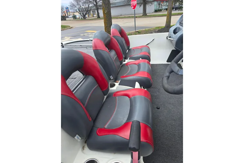 Slide: The Image of 2011 Nitro Z-7 boat interior with red and gray seats, steering wheel visible. - 4