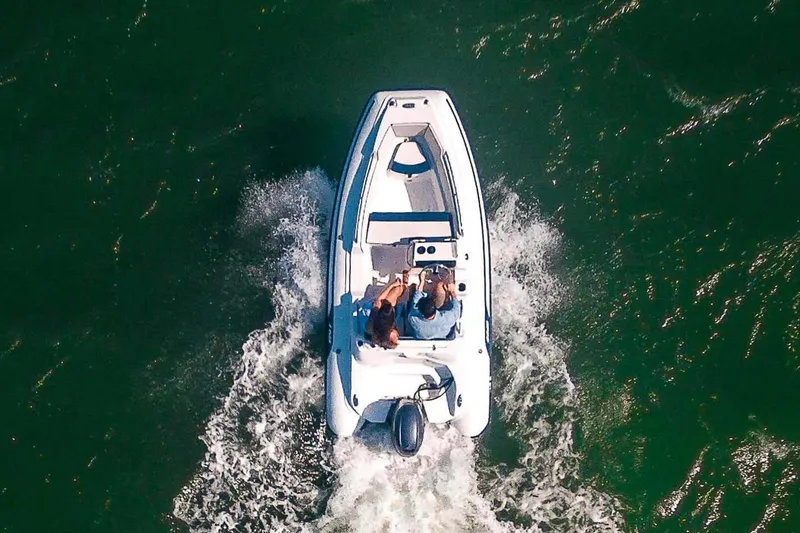 Slide: The Image of Manufacturer Provided Image: Aerial view of AB Inflatables Nautilus 13 DLX boat on water. - 3