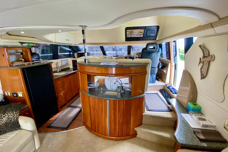 Slide: The Image of Luxurious interior of a 2000 Carver 450 Voyager Pilothouse yacht with elegant wood finishes. - 30