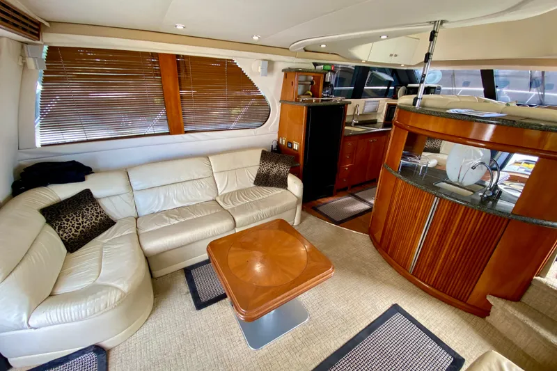 Slide: The Image of Luxurious interior of 2000 Carver 450 Voyager Pilothouse with leather seating and wooden accents. - 29