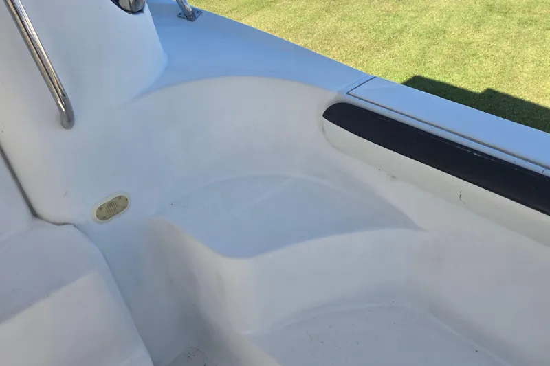 Slide: The Image of White deck area of 2000 Carver 450 Voyager Pilothouse with railing and seating. - 13