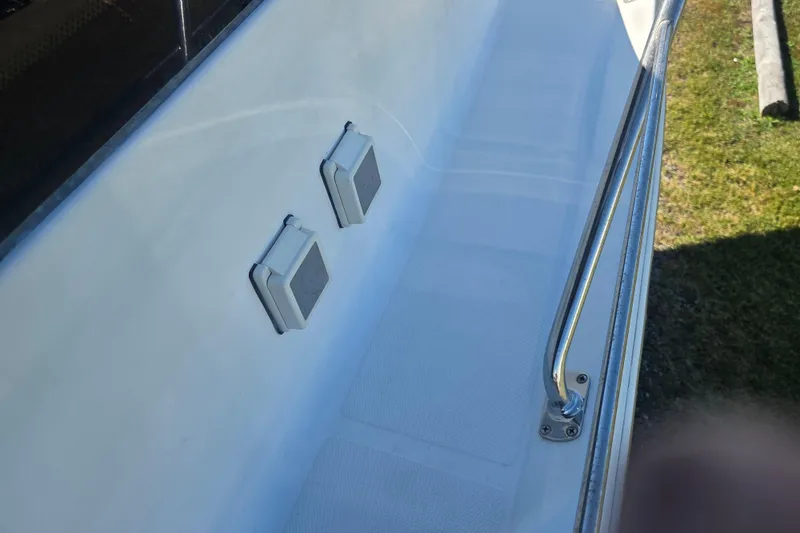 Slide: The Image of 2000 Carver 450 Voyager Pilothouse deck with railings and electrical outlets. - 15