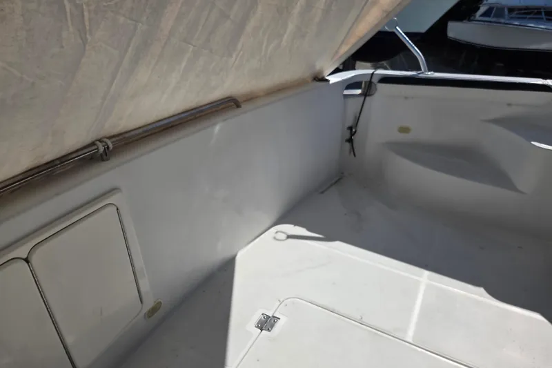 Slide: The Image of Interior view of a 2000 Carver 450 Voyager Pilothouse boat, featuring a clean, white deck area. - 17