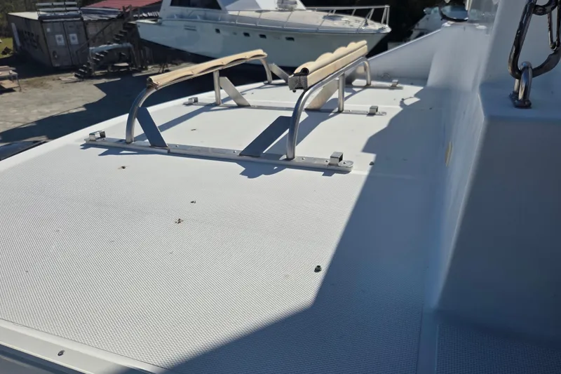 Slide: The Image of 2000 Carver 450 Voyager Pilothouse deck with stainless steel railings. - 19