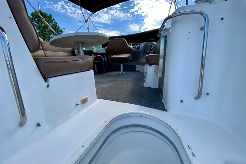 Slide: The Image of Interior view of 2000 Carver 450 Voyager Pilothouse with seating and table. - 90