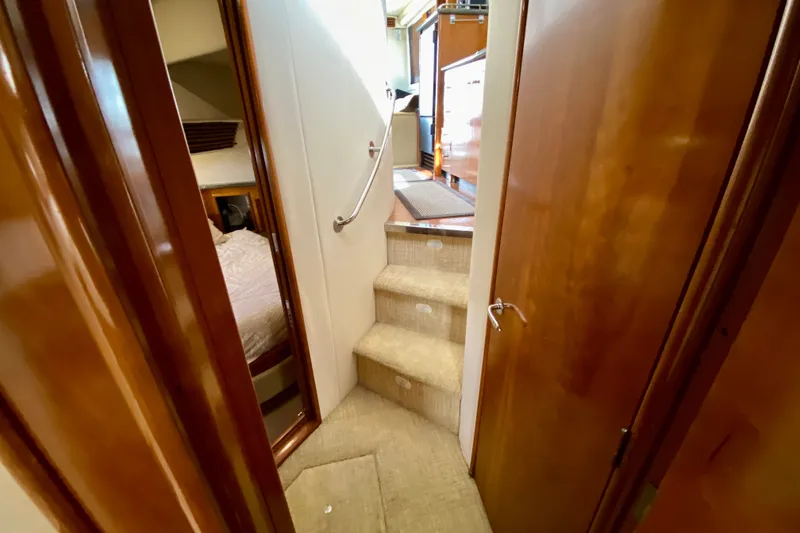 Slide: The Image of Interior view of 2000 Carver 450 Voyager Pilothouse, featuring stairs and wooden doors. - 38