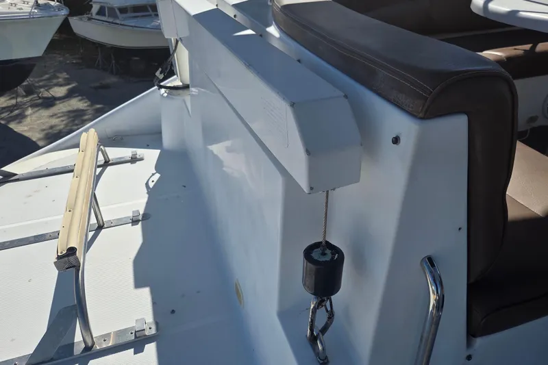 Slide: The Image of 2000 Carver 450 Voyager Pilothouse deck with seating and railing details. - 33