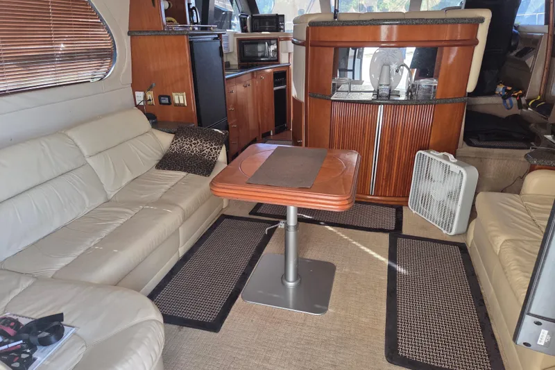 Slide: The Image of Interior of 2000 Carver 450 Voyager Pilothouse with leather seating and wooden cabinetry. - 36