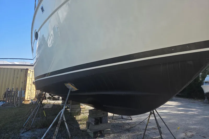 Slide: The Image of 2000 Carver 450 Voyager Pilothouse yacht on stands, side view, outdoors. - 4