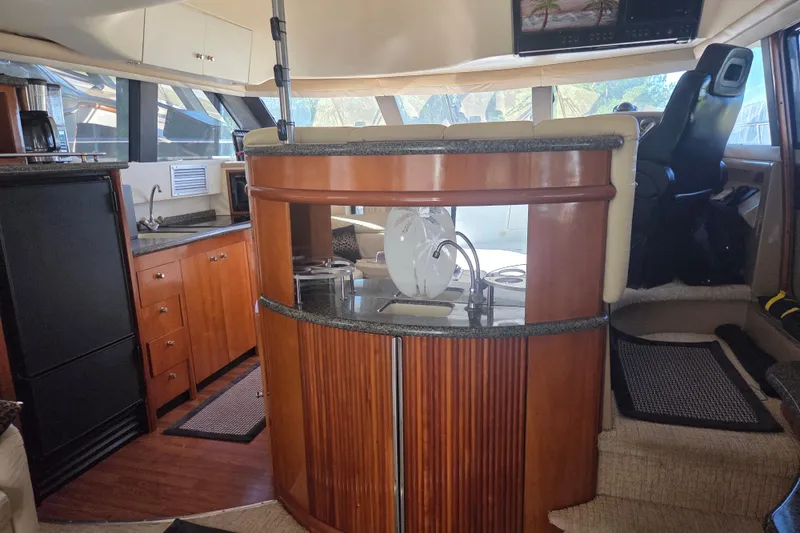 Slide: The Image of Interior of 2000 Carver 450 Voyager Pilothouse with modern kitchen and seating area. - 40