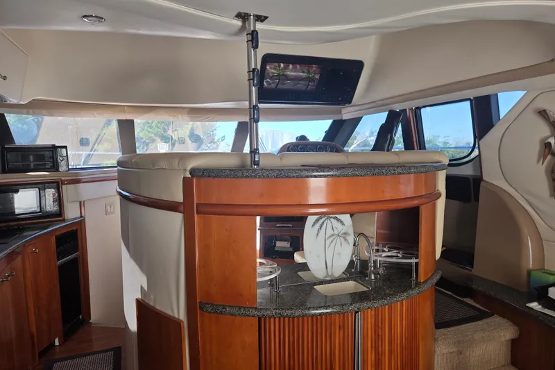 Slide: The Image of Interior of 2000 Carver 450 Voyager Pilothouse with modern kitchen and seating area. - 41