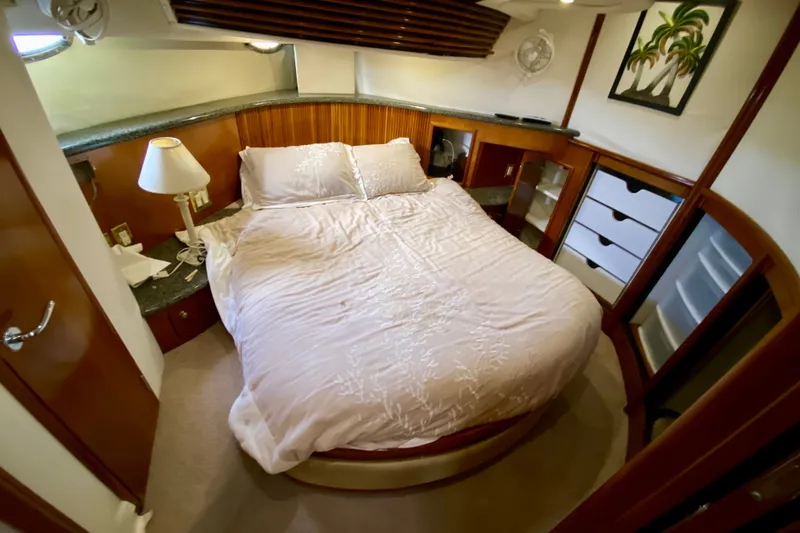 Slide: The Image of Luxurious bedroom interior of 2000 Carver 450 Voyager Pilothouse yacht with cozy bed and elegant decor. - 42