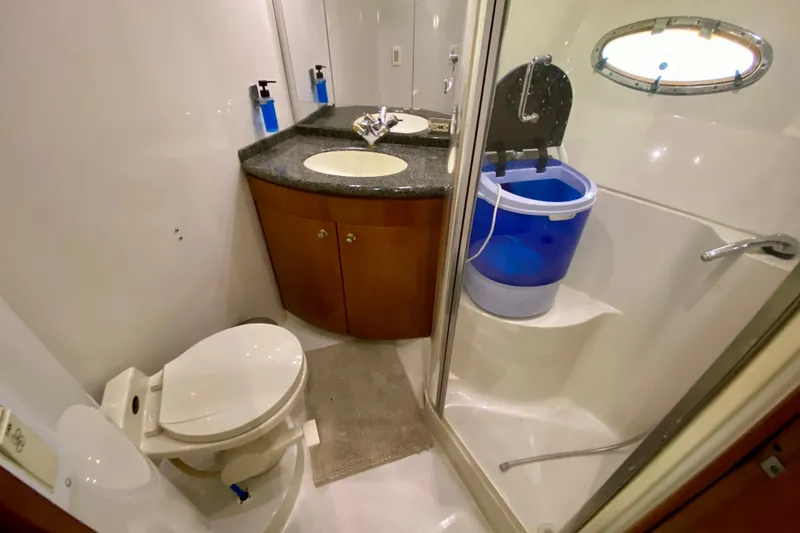 Slide: The Image of Bathroom interior of 2000 Carver 450 Voyager Pilothouse with shower, sink, and toilet. - 49