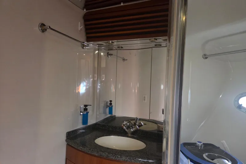 Slide: The Image of Bathroom interior of 2000 Carver 450 Voyager Pilothouse with sink and mirror. - 62
