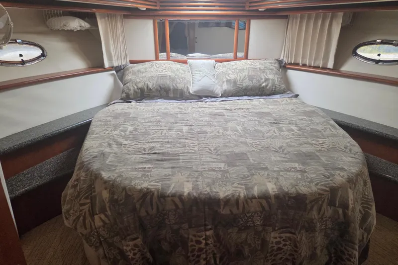 Slide: The Image of Luxurious bedroom interior of 2000 Carver 450 Voyager Pilothouse yacht. - 69