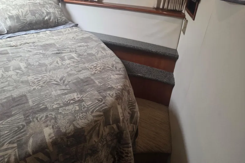 Slide: The Image of Interior of 2000 Carver 450 Voyager Pilothouse with bed and steps. - 70