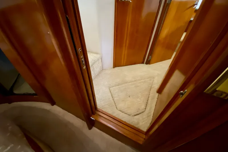 Slide: The Image of Interior view of 2000 Carver 450 Voyager Pilothouse with wooden doors and carpeted flooring. - 52