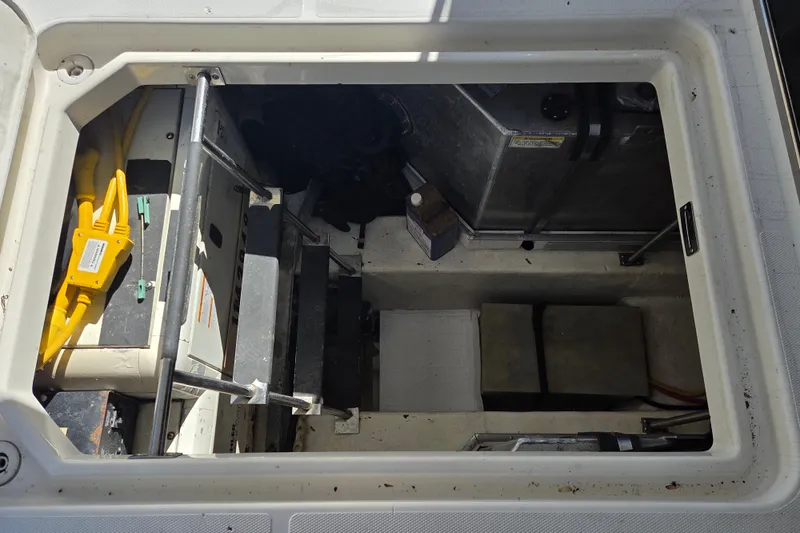 Slide: The Image of Engine compartment of a 2000 Carver 450 Voyager Pilothouse with visible wiring and components. - 78