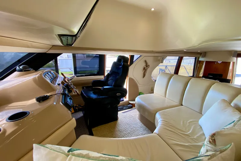 Slide: The Image of Luxurious interior of 2000 Carver 450 Voyager Pilothouse with plush seating and modern helm. - 61