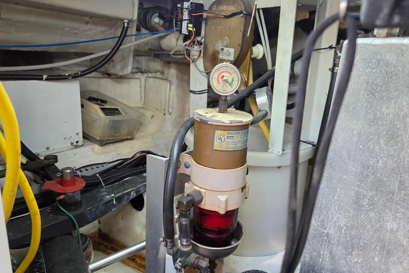Slide: The Image of Engine room of 2000 Carver 450 Voyager Pilothouse with fuel filter system. - 83