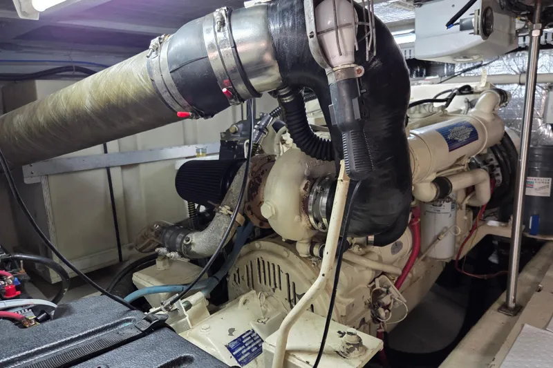 Slide: The Image of Engine room of 2000 Carver 450 Voyager Pilothouse with visible machinery and components. - 85