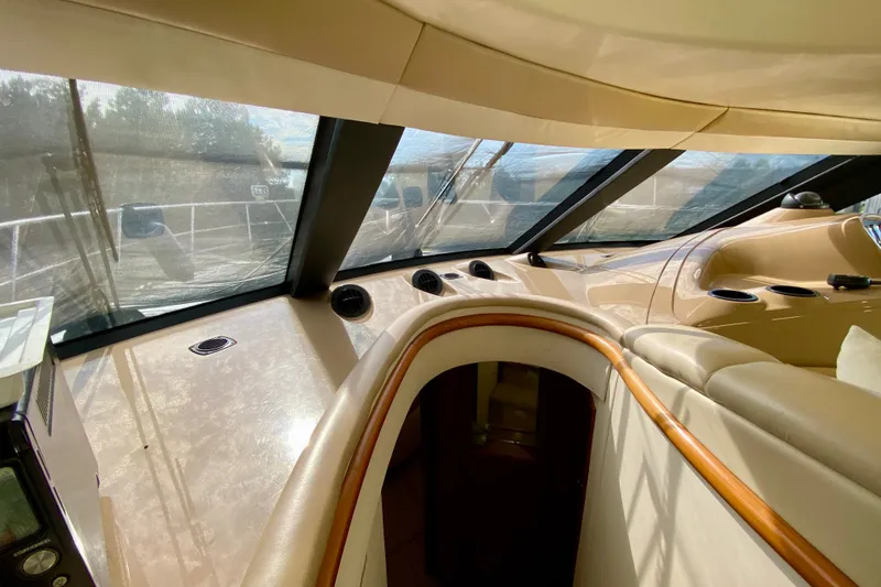 Slide: The Image of Interior view of 2000 Carver 450 Voyager Pilothouse, showcasing helm and seating area. - 60