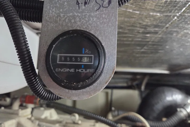 Slide: The Image of Engine hour meter showing 5555.5 hours on a 2000 Carver 450 Voyager Pilothouse. - 93