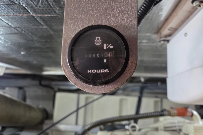 Slide: The Image of Hour meter in 2000 Carver 450 Voyager Pilothouse engine room. - 94