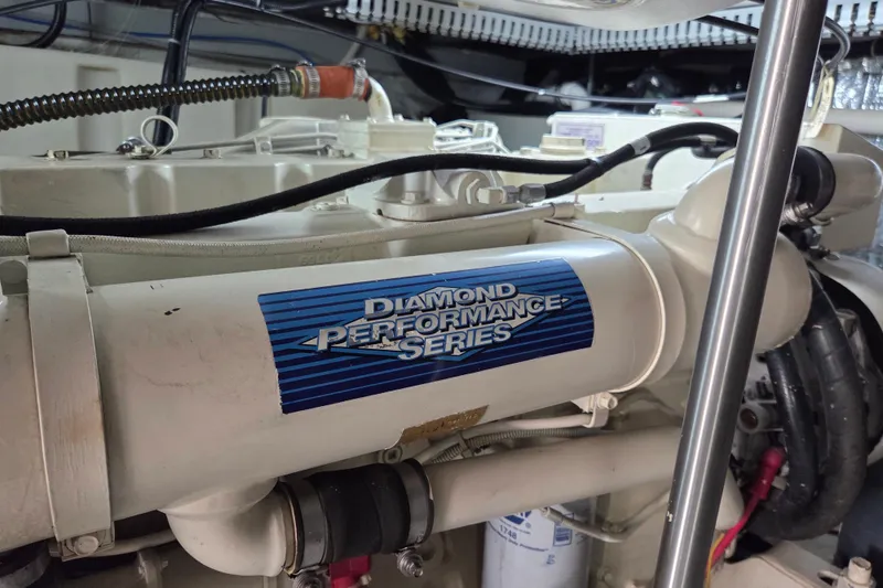 Slide: The Image of Engine compartment of 2000 Carver 450 Voyager Pilothouse, featuring Diamond Performance Series component. - 96