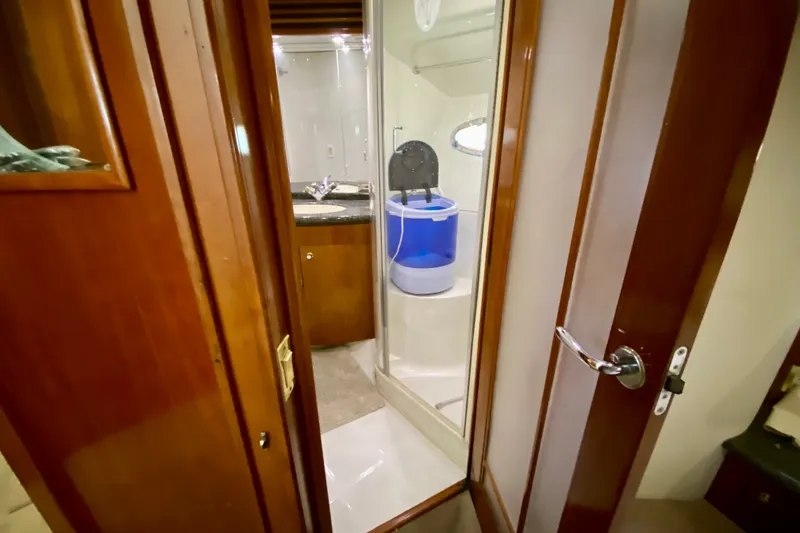 Slide: The Image of Interior of 2000 Carver 450 Voyager Pilothouse bathroom with shower and sink. - 48