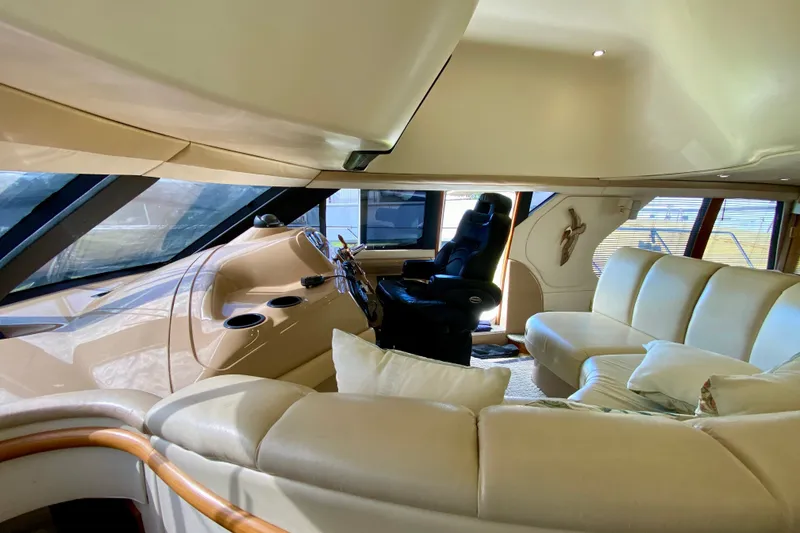 Slide: The Image of Luxurious interior of a 2000 Carver 450 Voyager Pilothouse yacht with plush seating. - 59