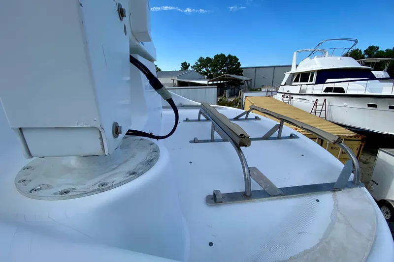 Slide: The Image of Rooftop view of a 2000 Carver 450 Voyager Pilothouse yacht in a marina setting. - 86