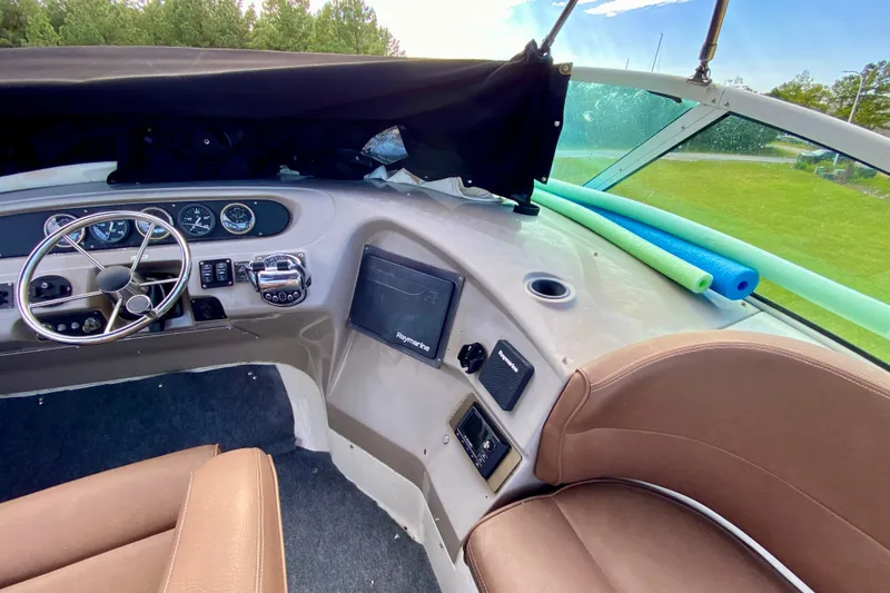 Slide: The Image of Interior of 2000 Carver 450 Voyager Pilothouse with steering wheel and navigation equipment. - 94