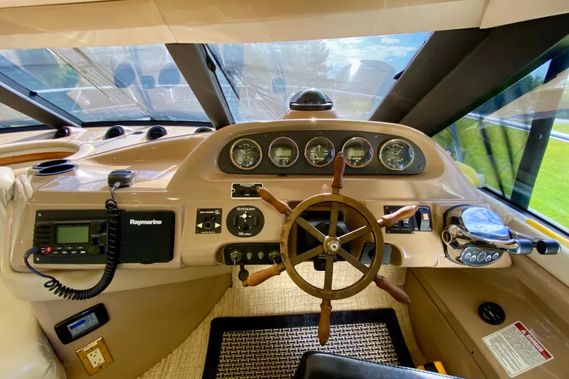 Slide: The Image of Pilothouse of 2000 Carver 450 Voyager with steering wheel and navigation instruments. - 67