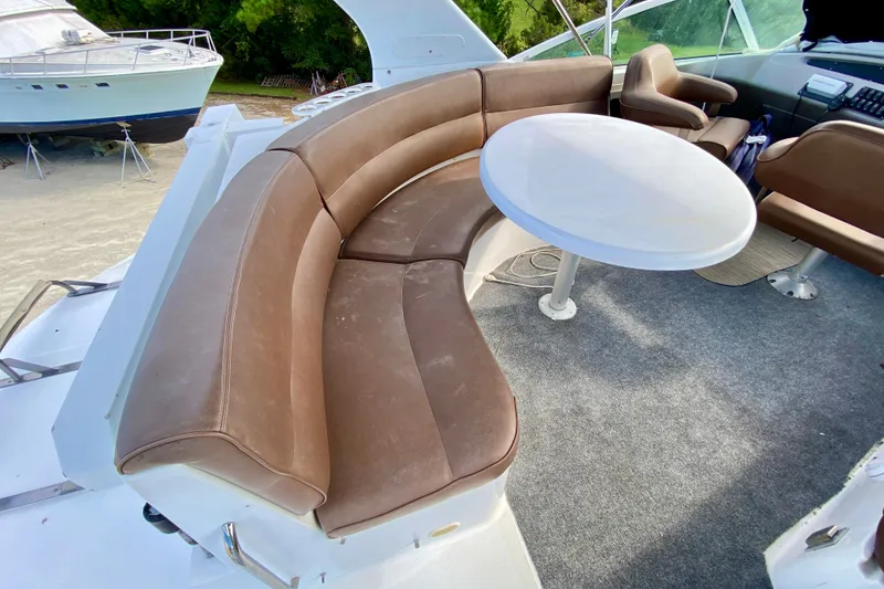 Slide: The Image of Brown leather seating and round table on 2000 Carver 450 Voyager Pilothouse yacht. - 100