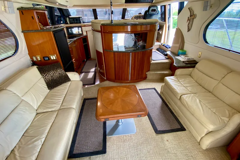 Slide: The Image of Luxurious interior of 2000 Carver 450 Voyager Pilothouse with leather seating and wooden accents. - 27