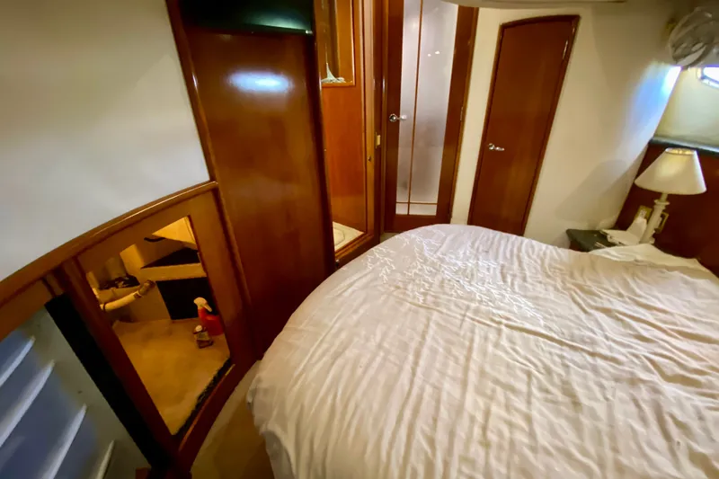 Slide: The Image of Interior of 2000 Carver 450 Voyager Pilothouse with cozy bedroom and wooden furnishings. - 44