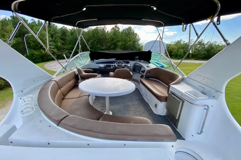 Slide: The Image of Interior view of 2000 Carver 450 Voyager Pilothouse with seating and helm. - 92