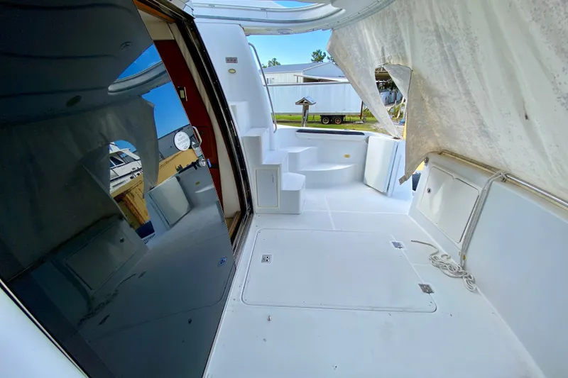 Slide: The Image of Spacious deck of 2000 Carver 450 Voyager Pilothouse with seating and storage. - 87