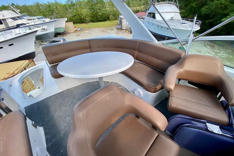 Slide: The Image of Luxurious seating area on 2000 Carver 450 Voyager Pilothouse yacht with round table. - 96