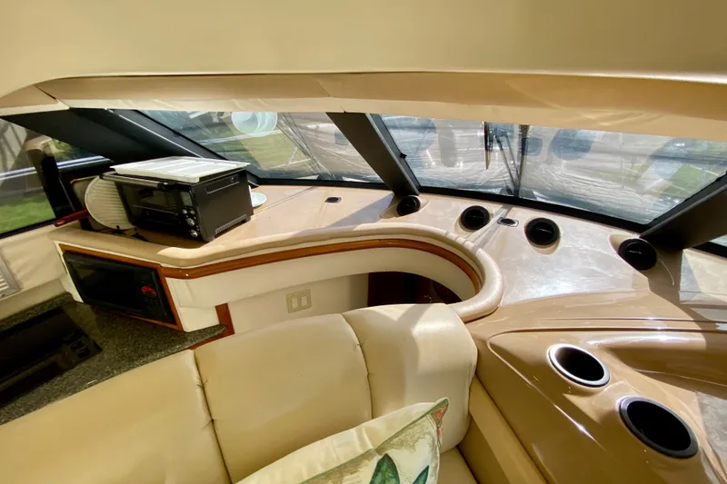 Slide: The Image of Interior of 2000 Carver 450 Voyager Pilothouse with modern appliances and seating. - 68