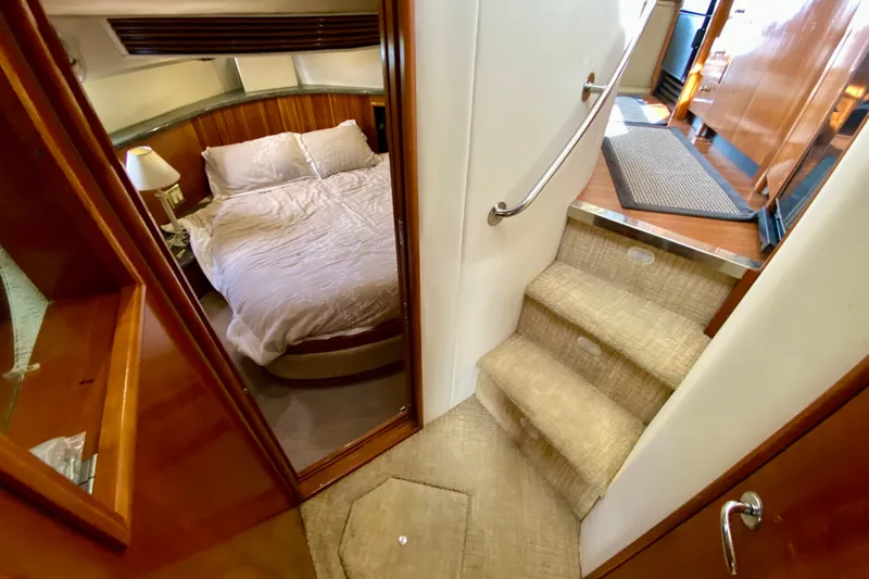 Slide: The Image of Interior of 2000 Carver 450 Voyager Pilothouse with cozy bedroom and carpeted stairs. - 41