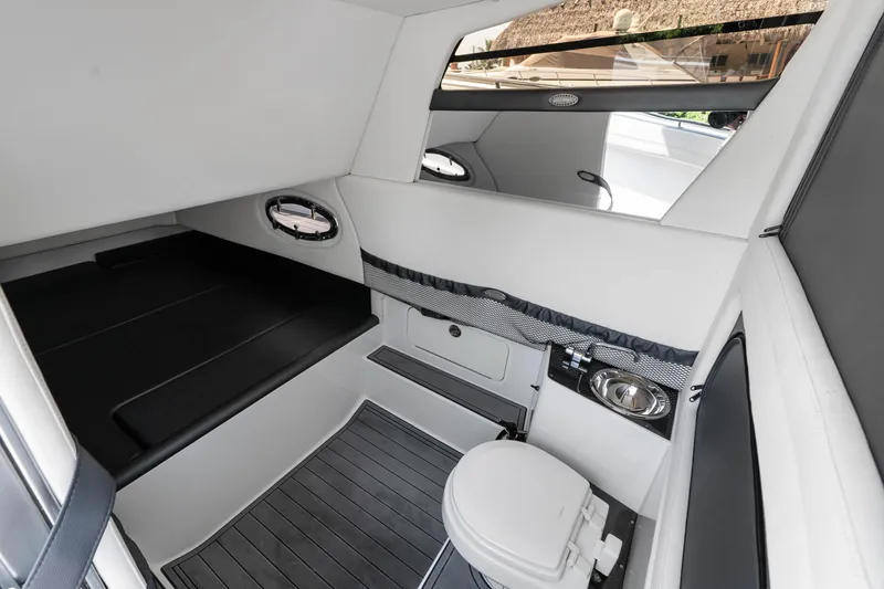 Slide: The Image of Interior cabin of 2021 Nor-Tech 390 Sport Center Console, featuring sleek design and modern amenities. - 10