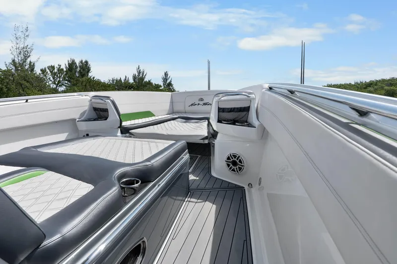 Slide: The Image of 2021 Nor-Tech 390 Sport Center Console boat interior with luxurious seating and sleek design. - 11