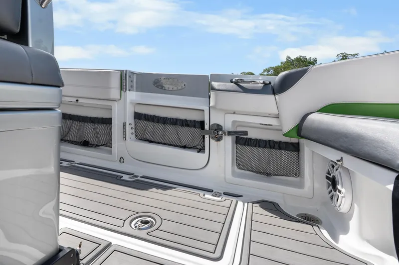 Slide: The Image of 2021 Nor-Tech 390 Sport Center Console interior with seating and storage compartments. - 19