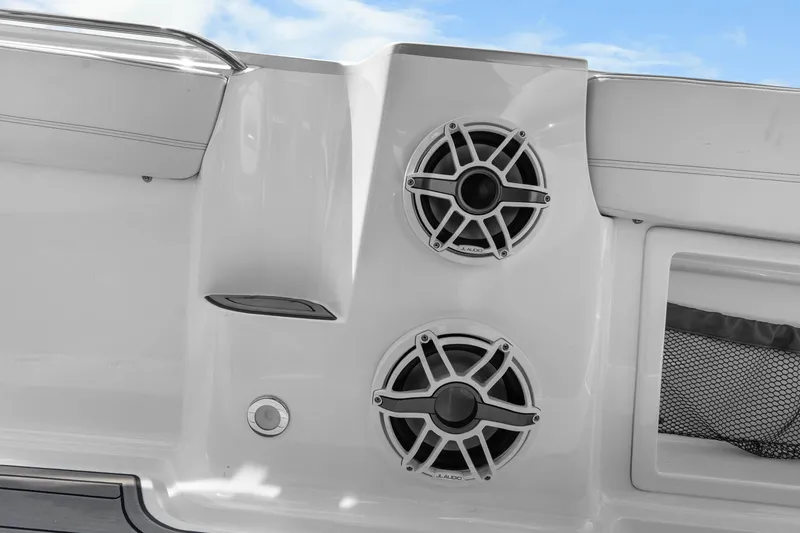 Slide: The Image of 2021 Nor-Tech 390 Sport Center Console speakers and deck detail against blue sky. - 20